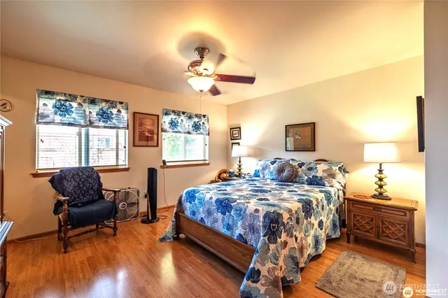 a bedroom with bed and window