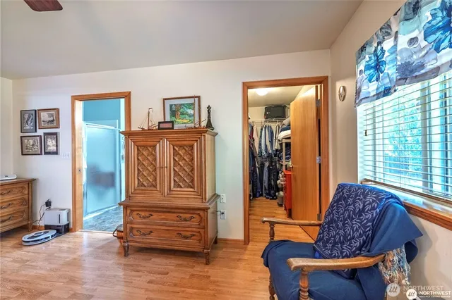 a bathroom with a double vanity sink mirror and toilet