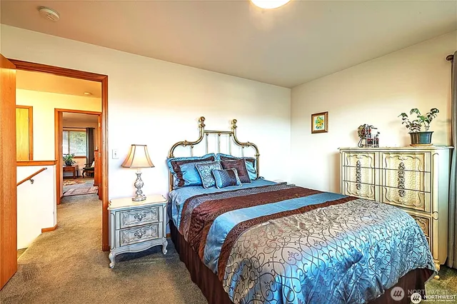 a bed room with a bed and a chandelier