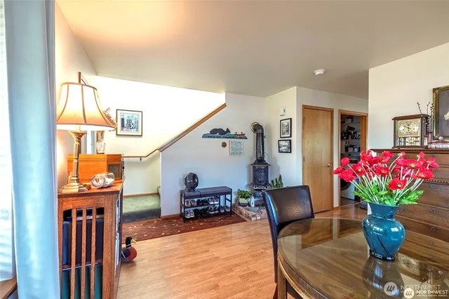 a dining room with furniture and flowers