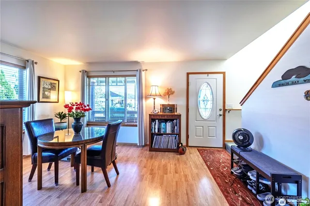 a view of a dining room with furniture window and wooden floor