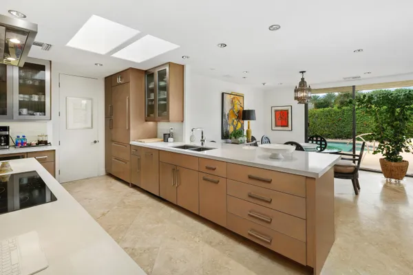 a kitchen with a sink stove and cabinets