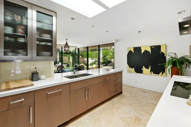 a kitchen with a sink stove and refrigerator