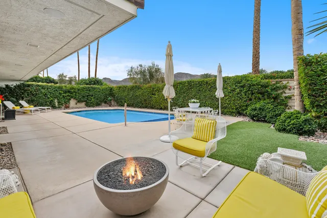 a view of yard with patio