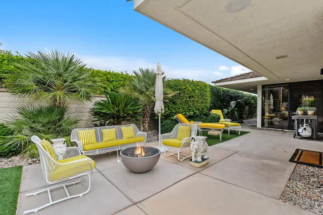 a spacious bedroom with a bed and a large window