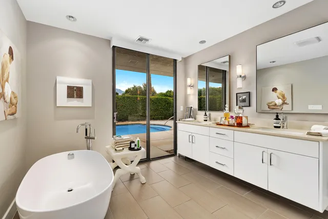 a bathroom with a shower sink and mirror