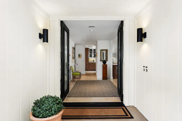 a living room with furniture a rug and a fireplace