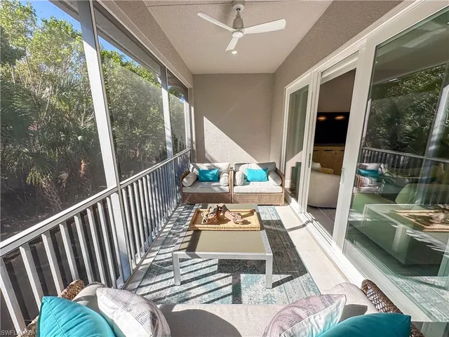 a view of a balcony with furniture