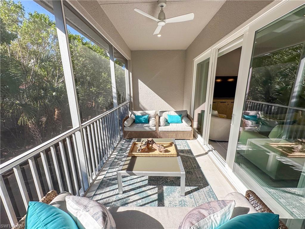 232 Indies Drive East, Unit 201 Naples, FL 34114 - Photo 14 of 49 a view of a balcony with furniture