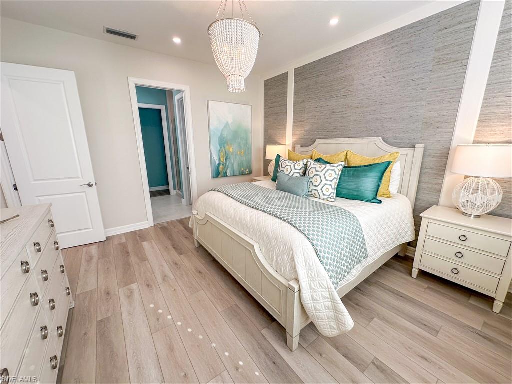 232 Indies Drive East, Unit 201 Naples, FL 34114 - Photo 20 of 49 a large white bed in a white room