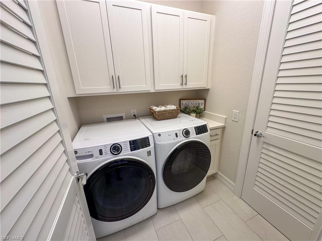 232 Indies Drive East, Unit 201 Naples, FL 34114 - Photo 29 of 49 a utility room with dryer and washer