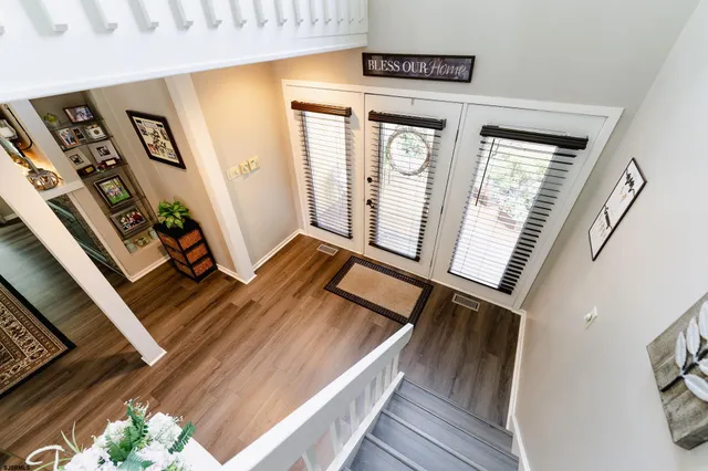 a view of an entryway with wooden floor