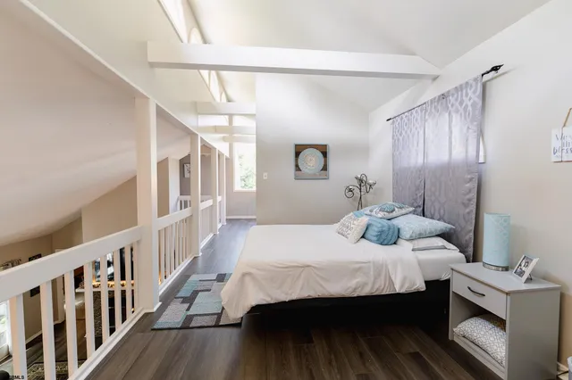 a bedroom with a bed and a table