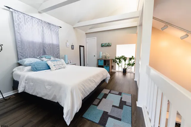 a bedroom with a bed and a table