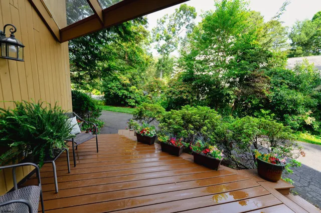 a view of a backyard with sitting area