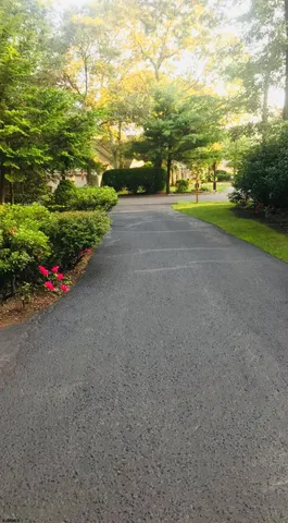a view of a road with an ocean view