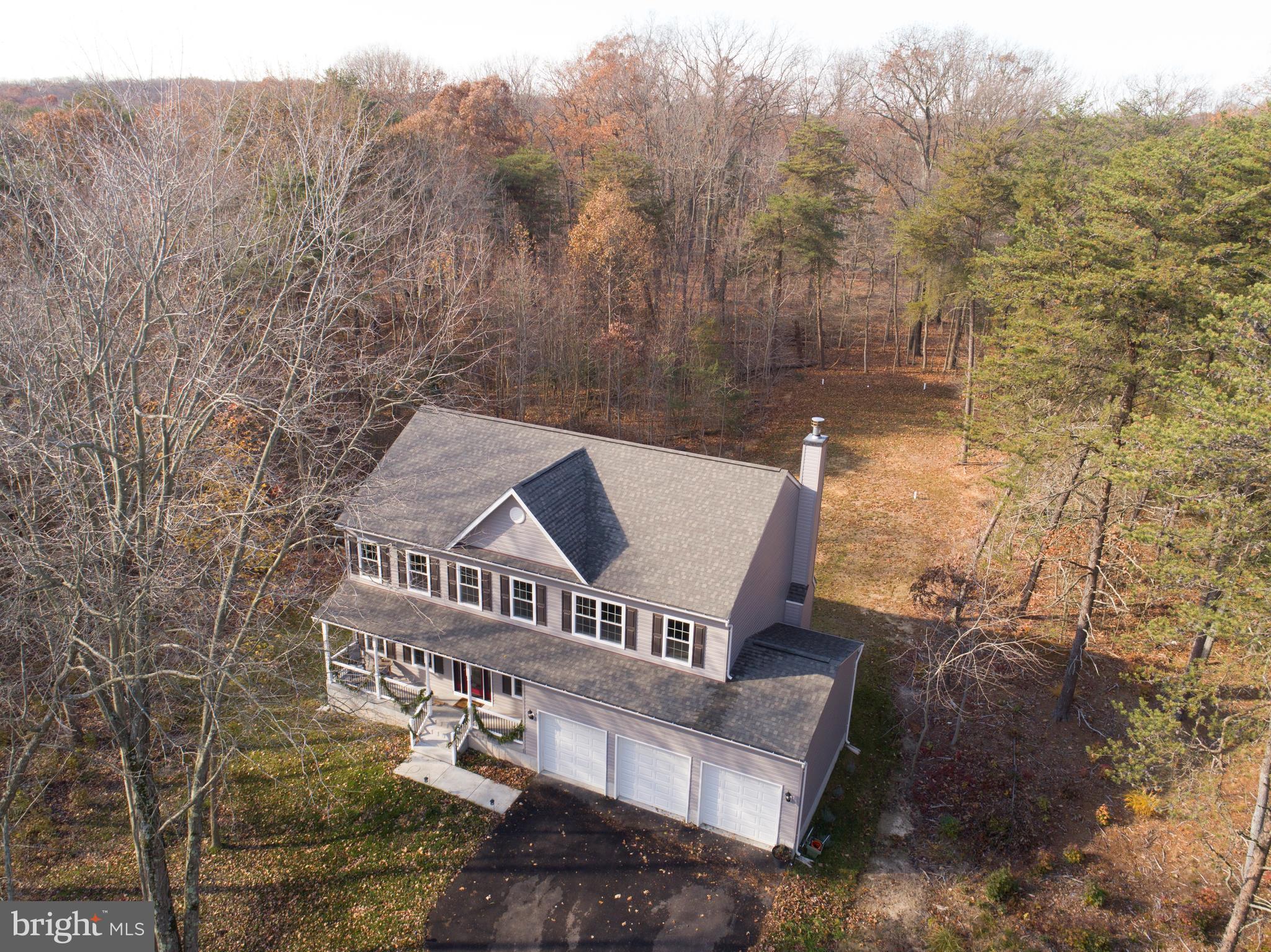 7720 Paradise Beach Road Pasadena, MD 21122 - Photo 1 of 23 Beautiful foliage surrounds this home