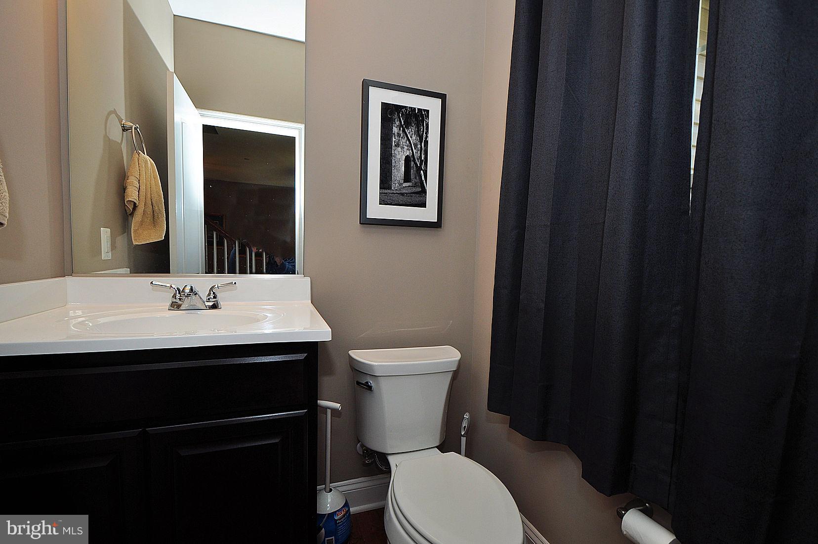 7720 Paradise Beach Road Pasadena, MD 21122 - Photo 20 of 23 Half bath on 1st level