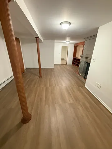 wooden floor with an entryway