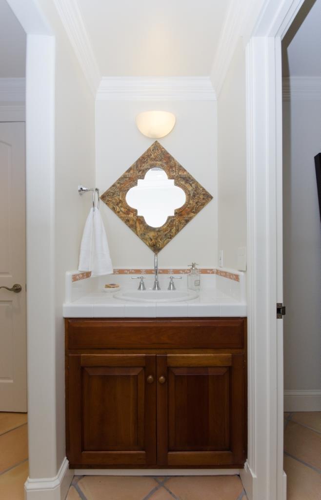 26990 Taaffe Road Los Altos Hills, CA 94022 - Photo 16 of 25 a bathroom with a sink and a mirror