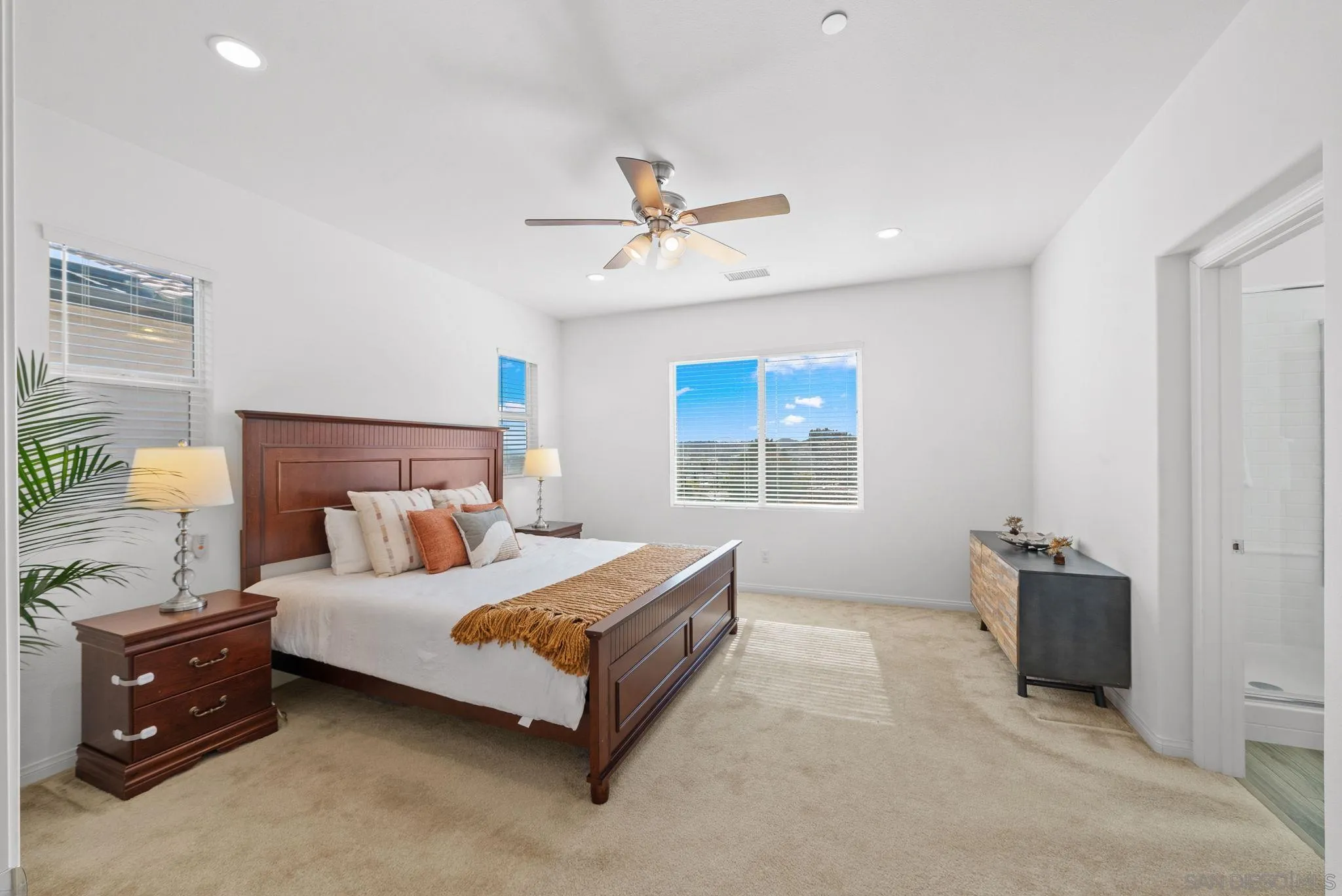 8749 Scrub Oak Street Santee, CA 92071 - Photo 11 of 43 a bedroom with a bed and a chandelier