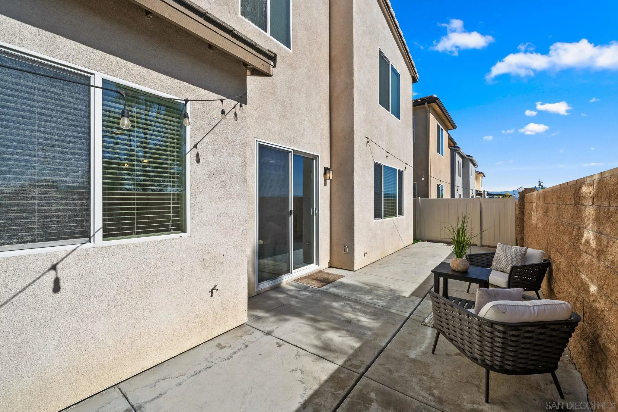 8749 Scrub Oak Street Santee, CA 92071 - Photo 26 of 43 a patio with patio a couch and chairs