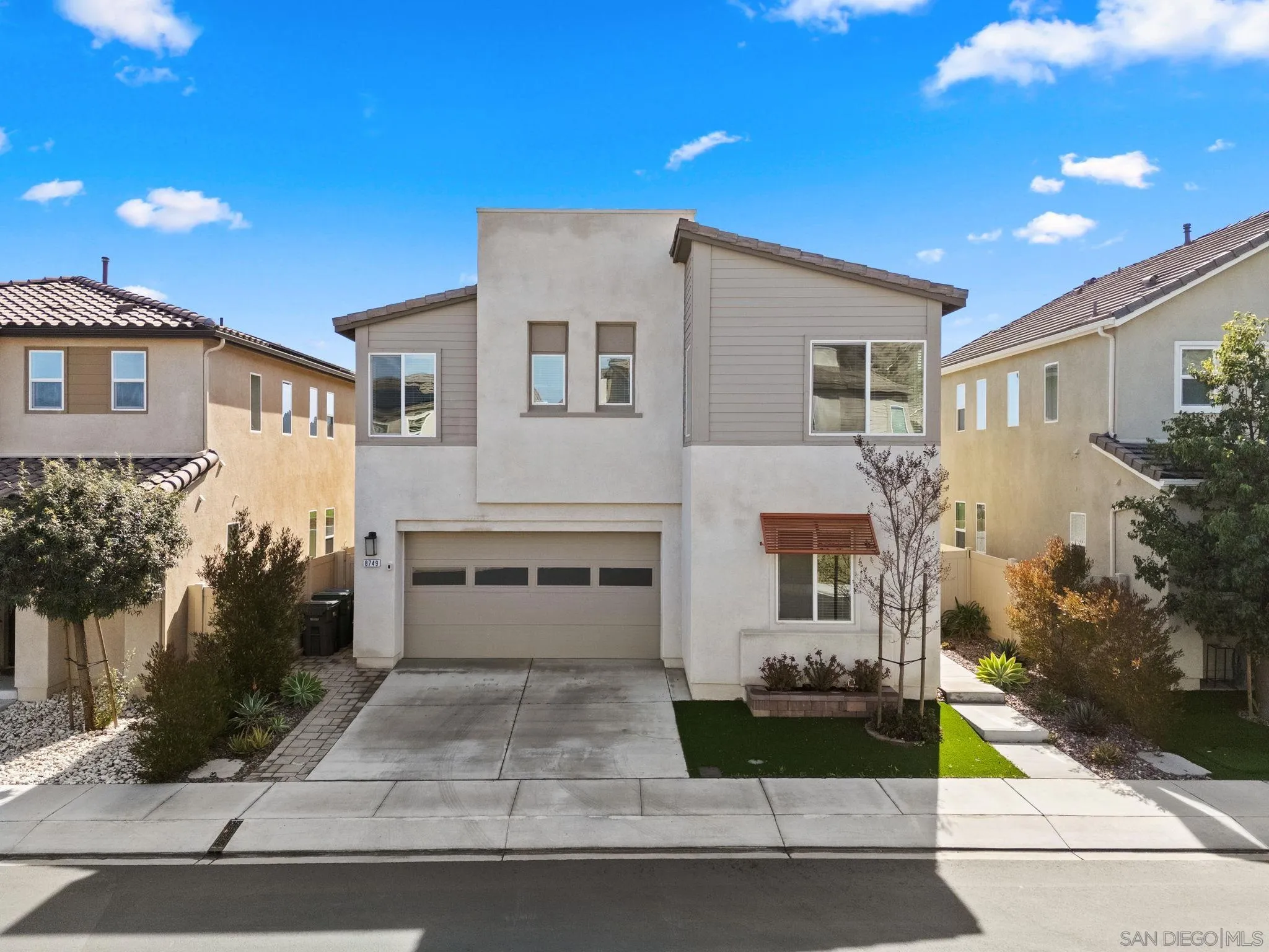 8749 Scrub Oak Street Santee, CA 92071 - Photo 37 of 43 a front view of a house with garden
