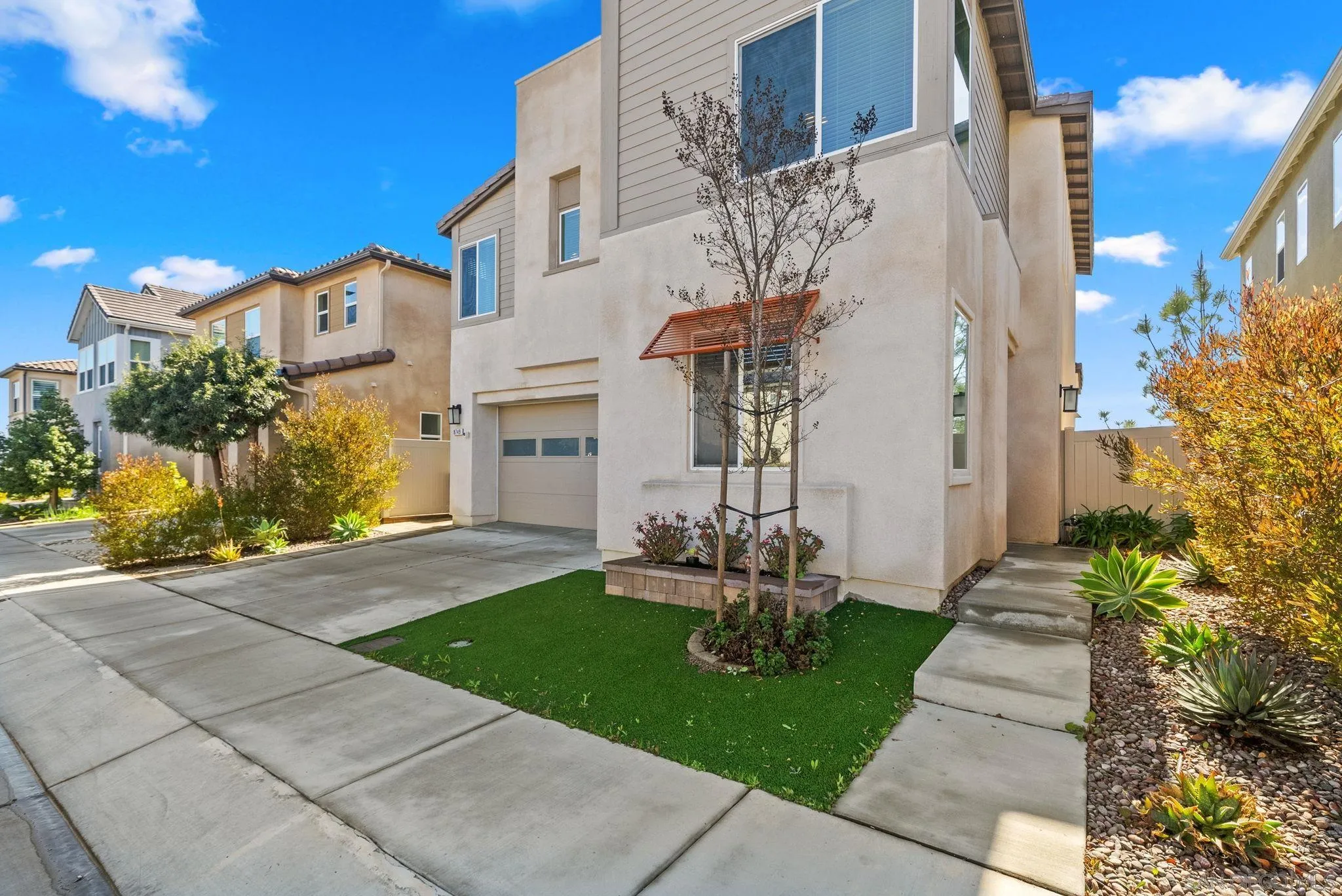 8749 Scrub Oak Street Santee, CA 92071 - Photo 39 of 43 a front view of a building with garden