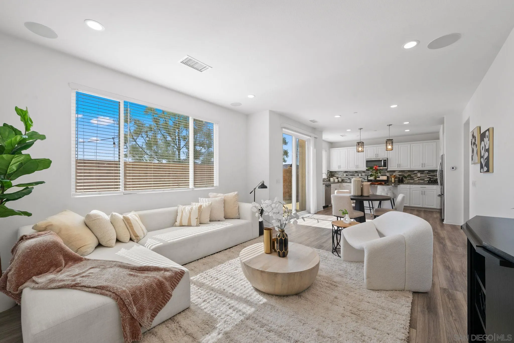 8749 Scrub Oak Street Santee, CA 92071 - Photo 4 of 43 a living room with furniture kitchen and a large window