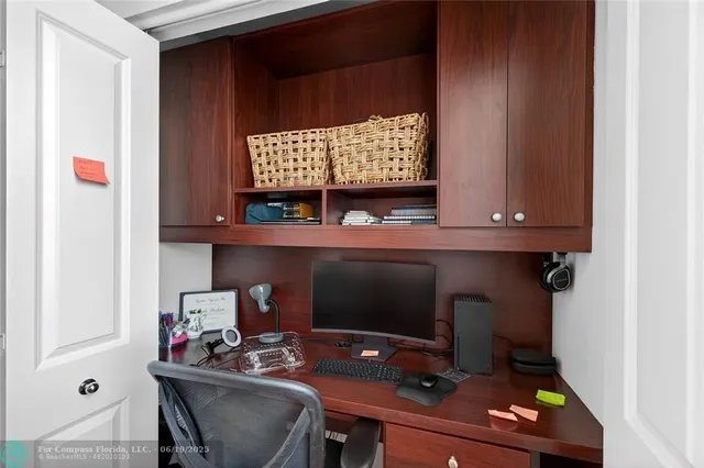 a view of a room with a table and chairs