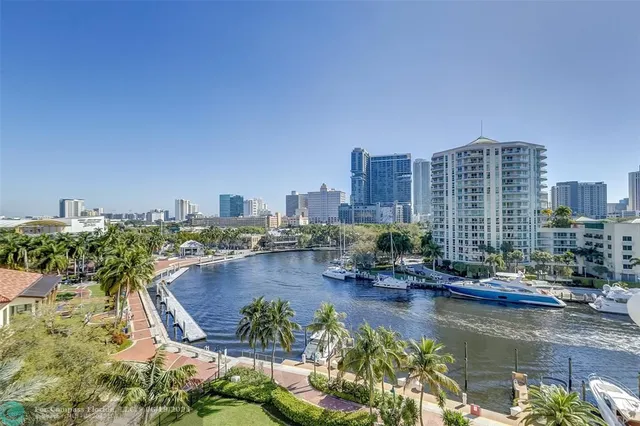 a view of a swimming pool with outdoor seating and plants