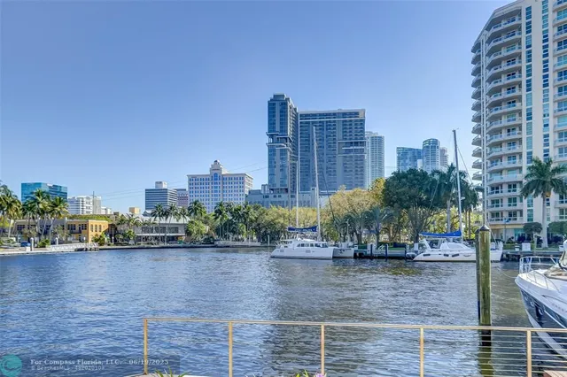a view of a patio with a yard and plants