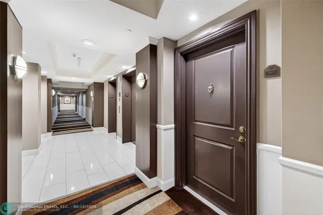 a view of gallery with wooden floor