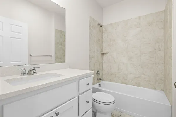 a bathroom with a sink a toilet and a bathtub