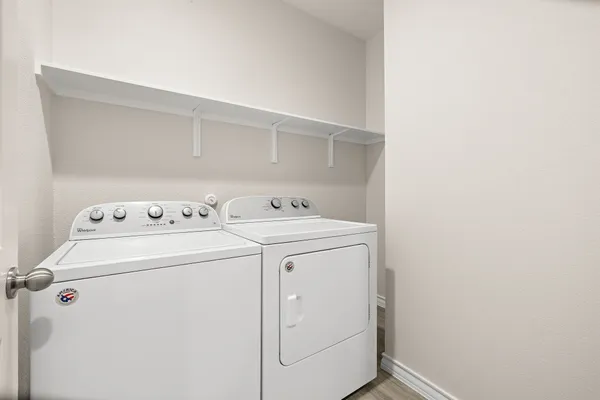 a utility room with dryer and washer
