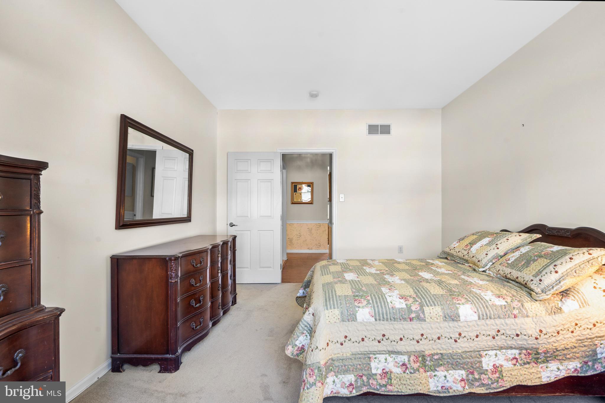 24 Tupelo Lane Langhorne, PA 19047 - Photo 12 of 37 a bedroom with a bed and wooden floor