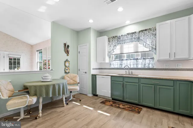 a living room with a sink and a window