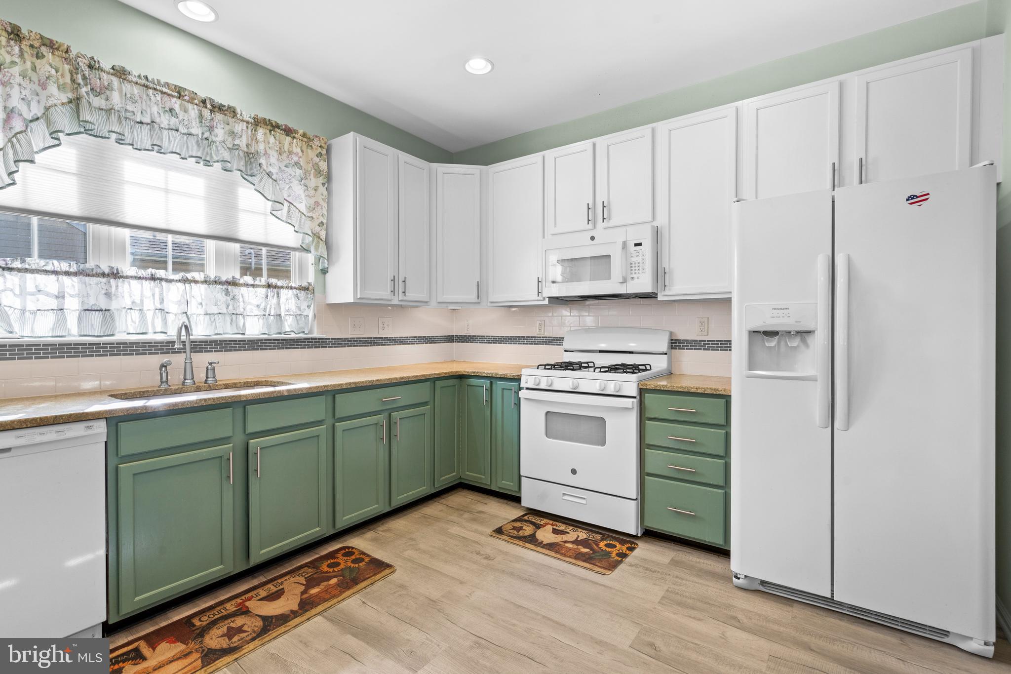 24 Tupelo Lane Langhorne, PA 19047 - Photo 14 of 37 a kitchen with granite countertop a sink stainless steel appliances and cabinets