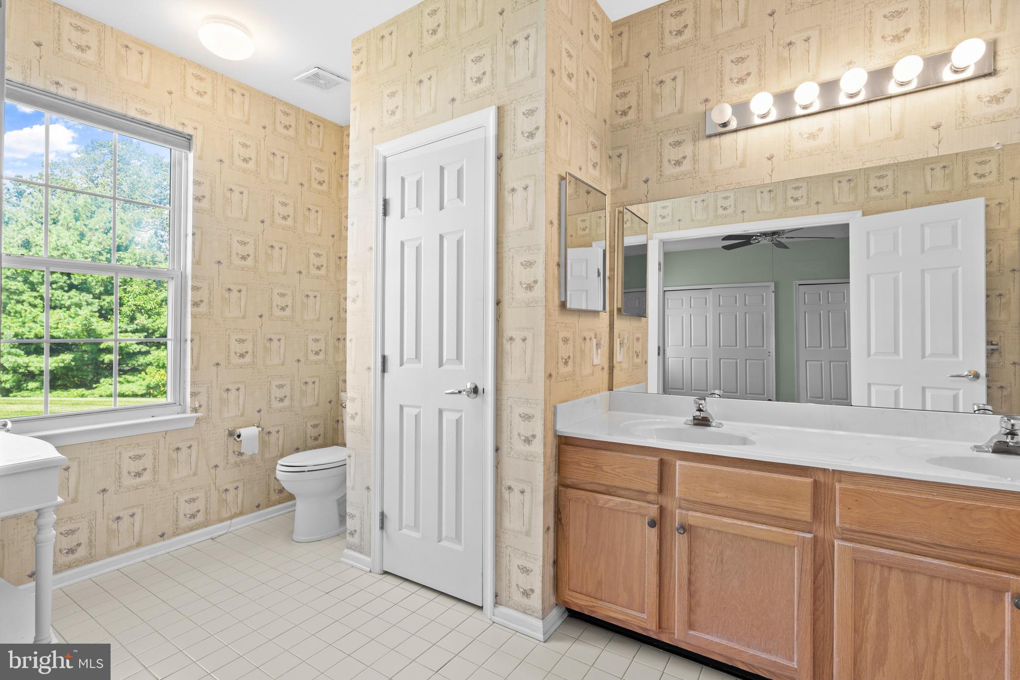 24 Tupelo Lane Langhorne, PA 19047 - Photo 21 of 37 a spacious bathroom with a granite countertop sink toilet and shower