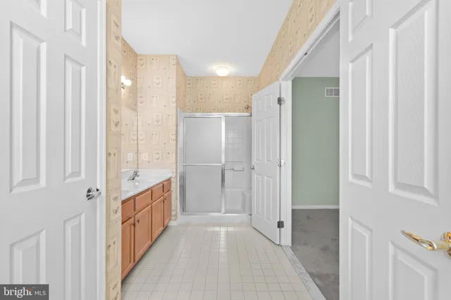 a view of a house with wooden deck