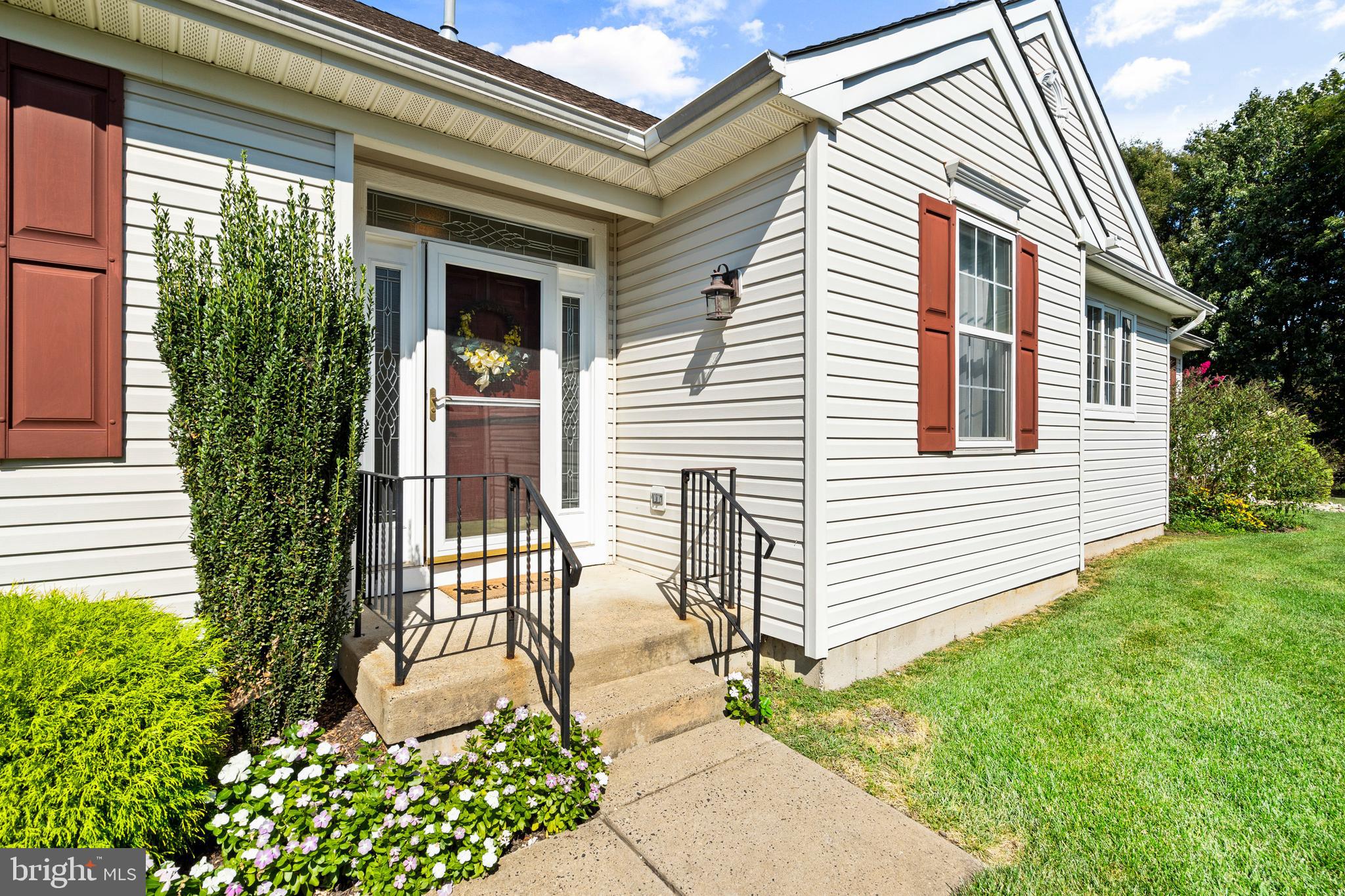 24 Tupelo Lane Langhorne, PA 19047 - Photo 26 of 37 a front view of a house with garden