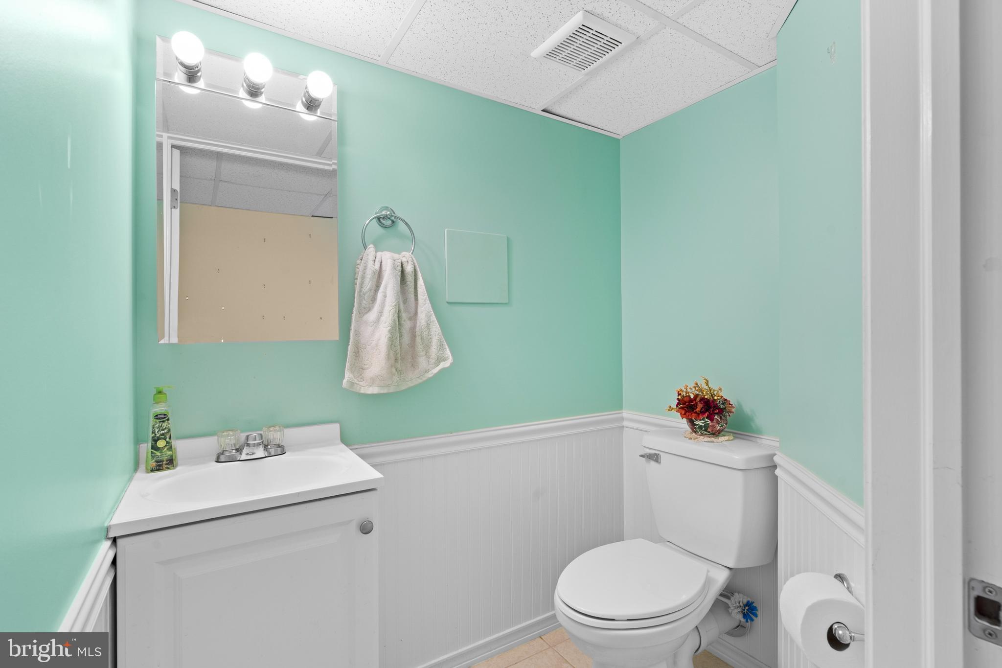 24 Tupelo Lane Langhorne, PA 19047 - Photo 29 of 37 a bathroom with a sink a toilet and a mirror