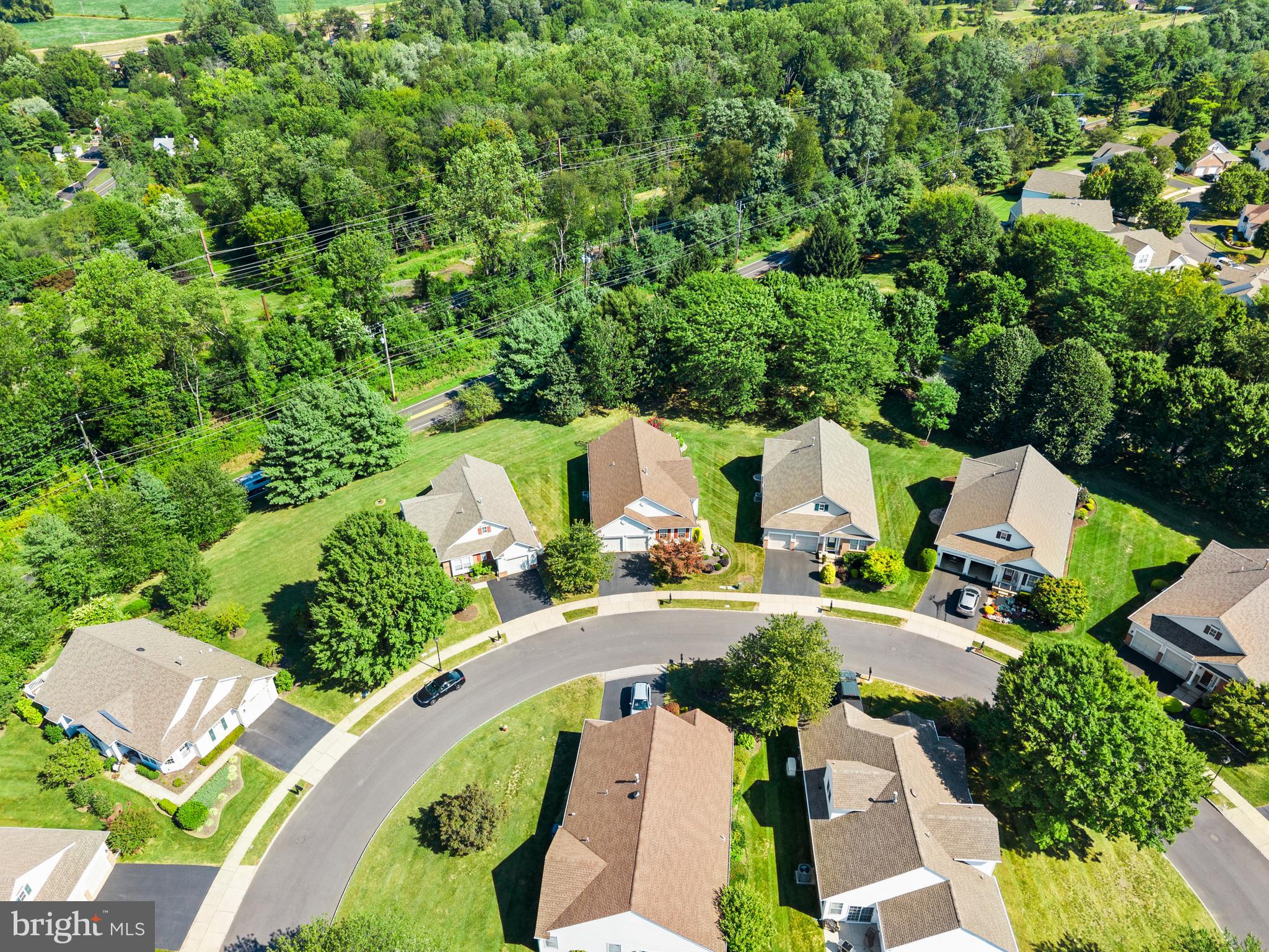 24 Tupelo Lane Langhorne, PA 19047 - Photo 37 of 37 an aerial view of a house with a yard and greenery
