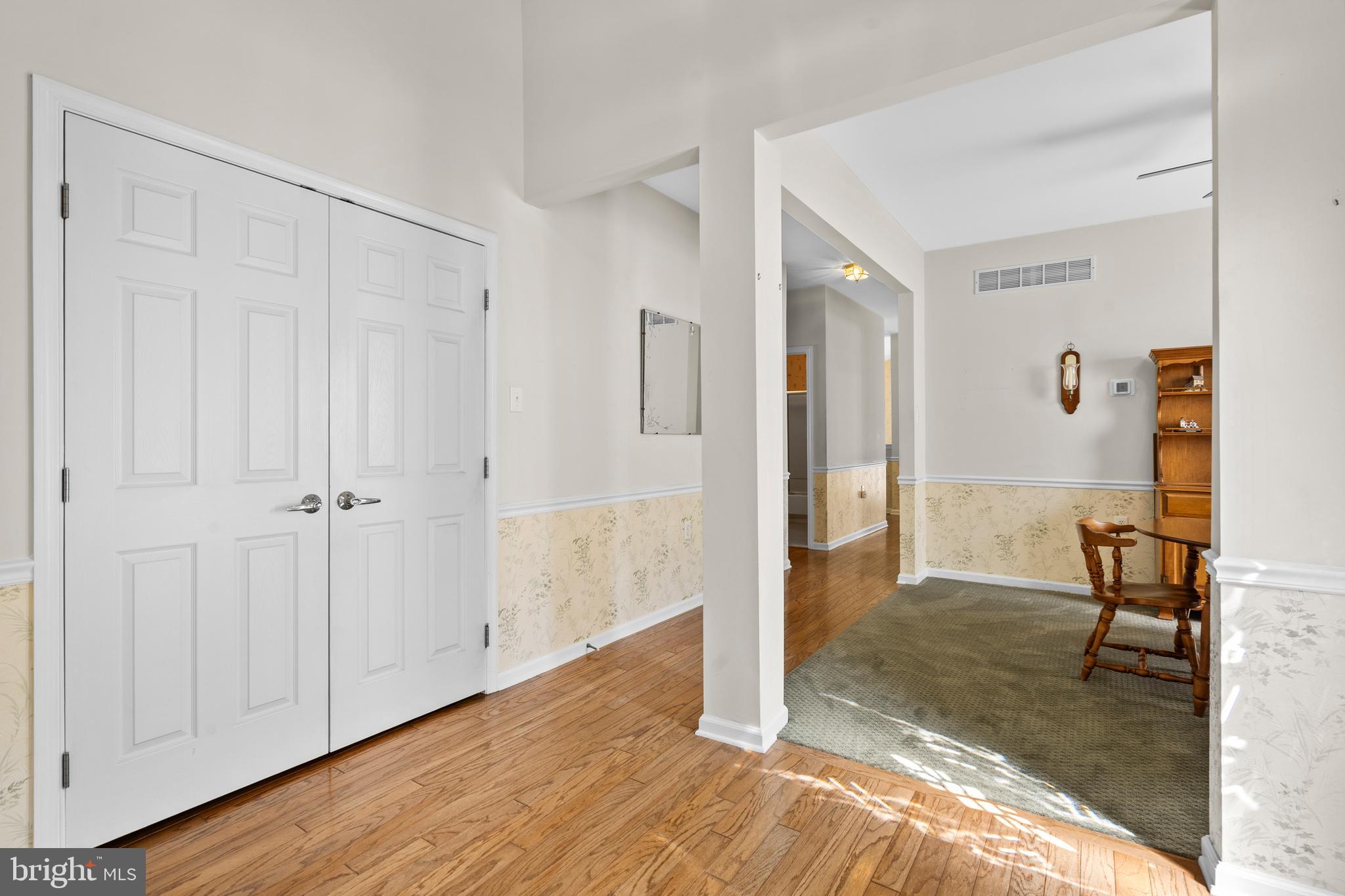 24 Tupelo Lane Langhorne, PA 19047 - Photo 4 of 37 a view of a livingroom with wooden floor and a bathroom