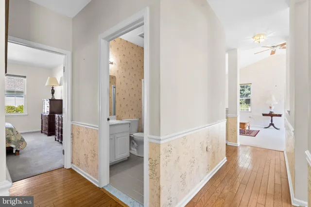 a view of a bedroom and wooden floor