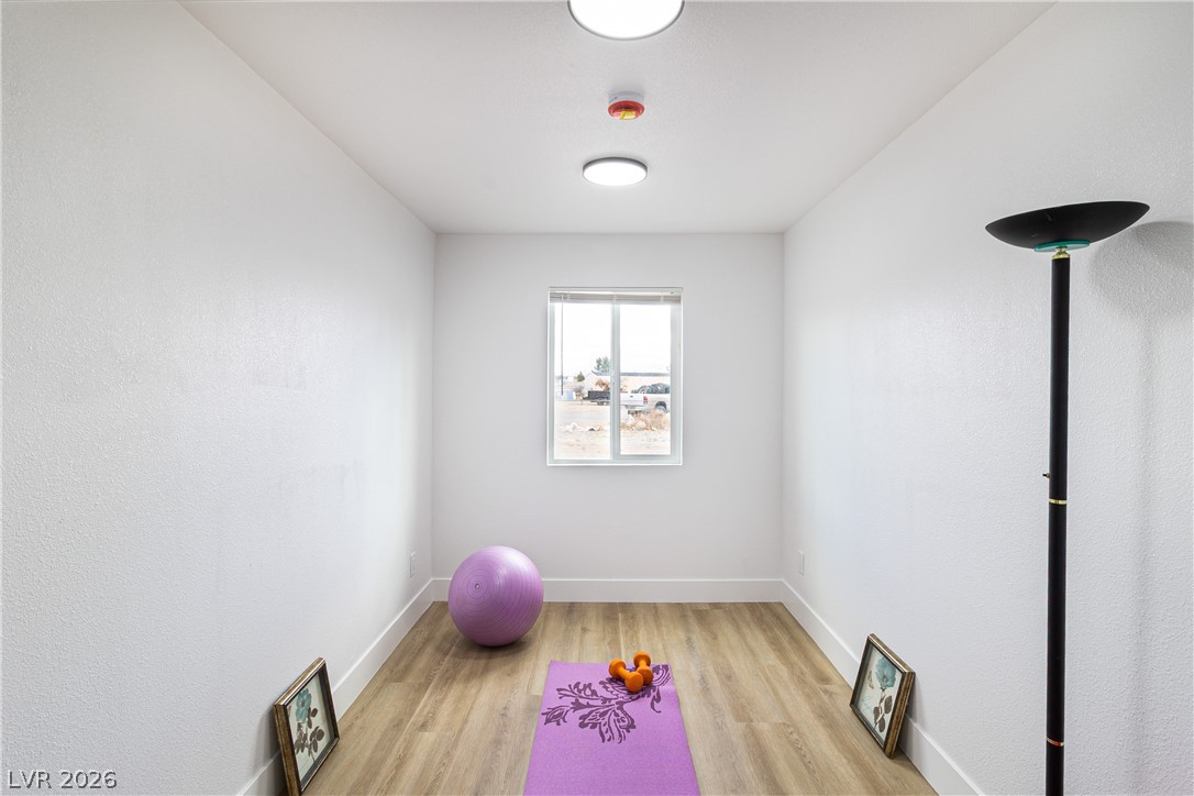 1891 Brian Road Pahrump, NV 89048 - Photo 20 of 50 Exercise area featuring light wood-style flooring and baseboards