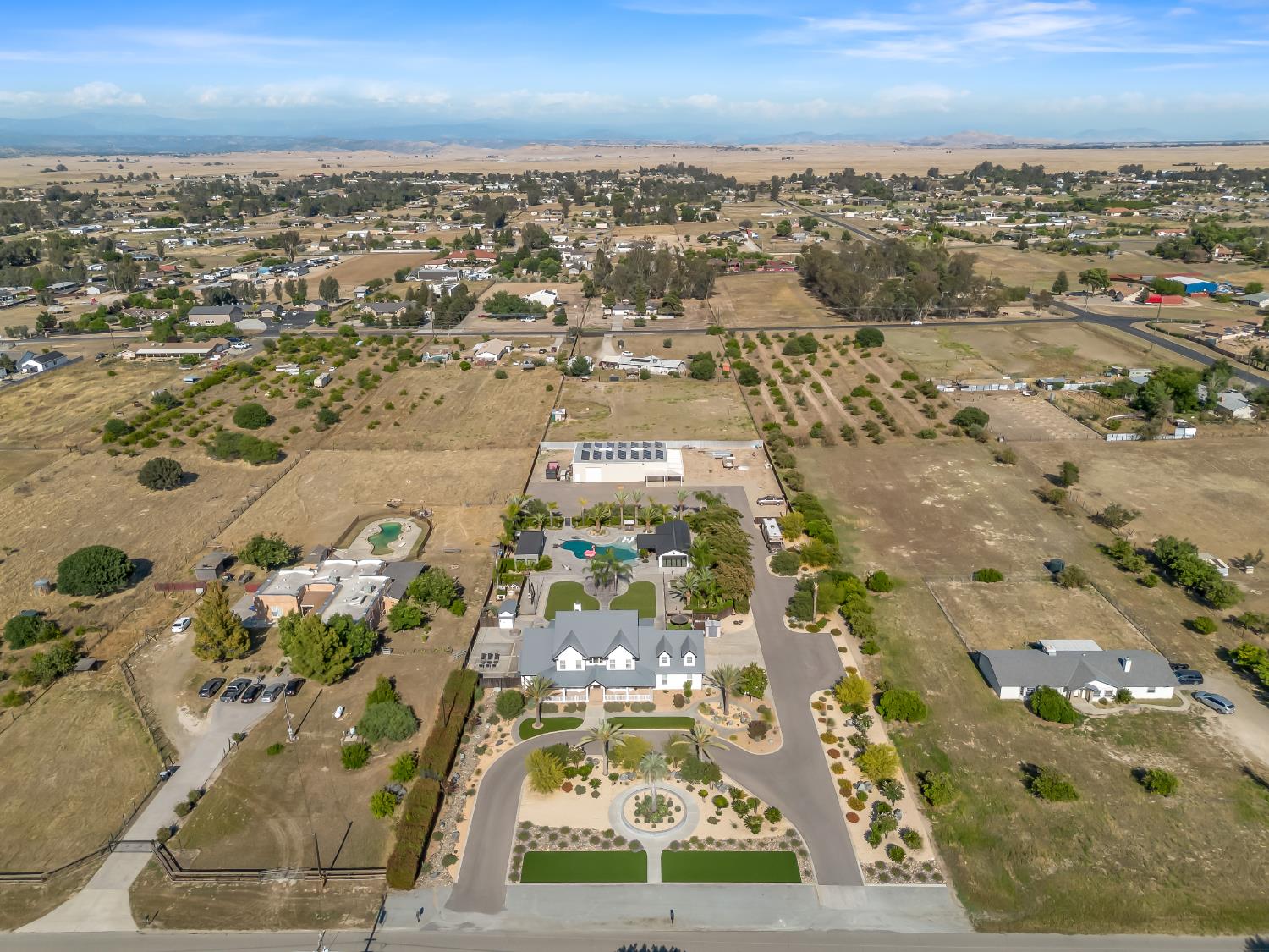 17113 Mark Road Madera, CA 93636 - Photo 89 of 99 an aerial view of residential houses with outdoor space