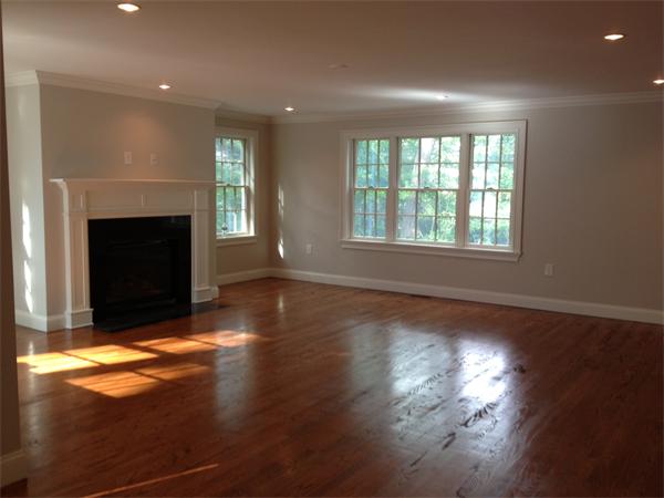 55 Fox Hill Road Wellesley, MA 02481 - Photo 7 of 10 a view of an empty room with wooden floor fireplace and a window