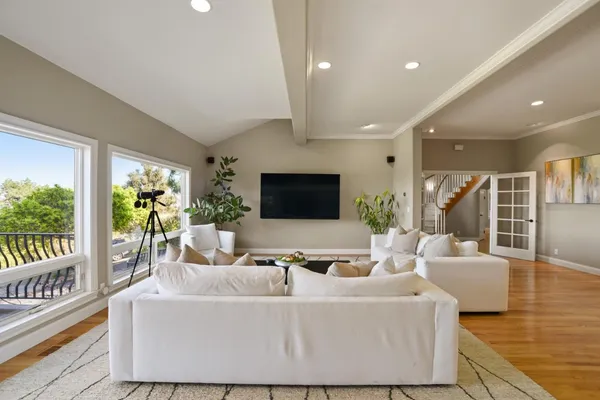 a living room with furniture and a flat screen tv