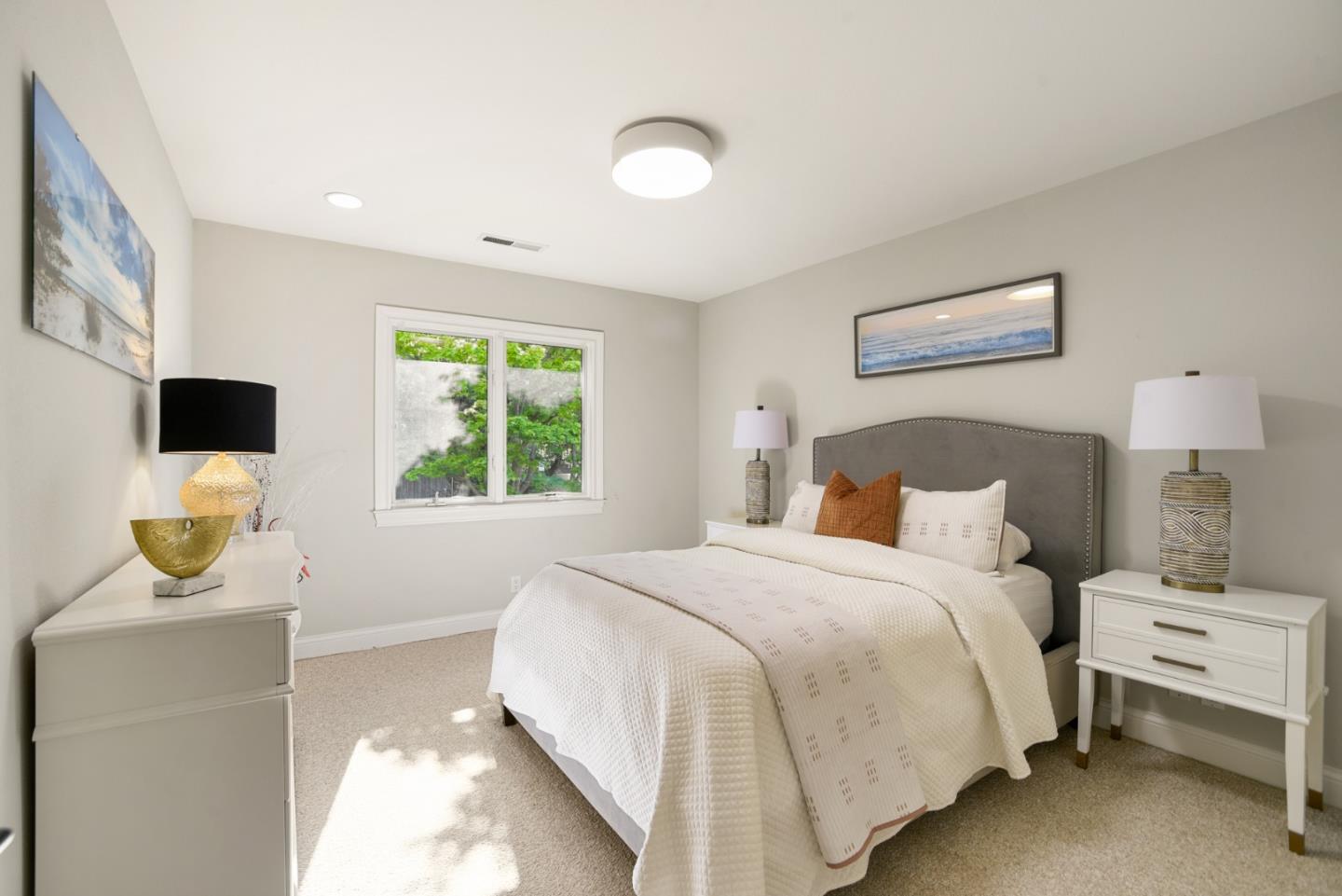 18782 Withey Road Monte Sereno, CA 95030 - Photo 19 of 39 a bedroom with a bed and a flat screen tv